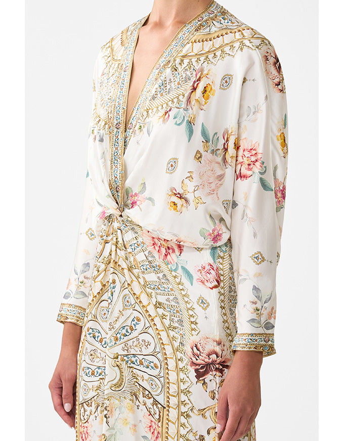 Floral and paisley patterned dress on a white background. Ottoman Dynasty Twist Front Batwing Dress