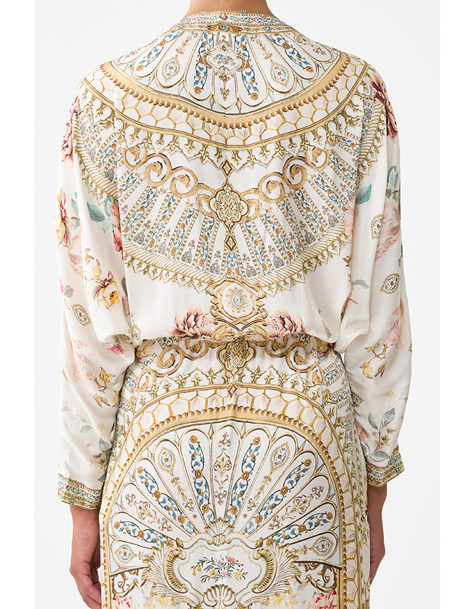 Elegant outfit with intricate patterns on a white background. Ottoman Dynasty Twist Front Batwing Dress