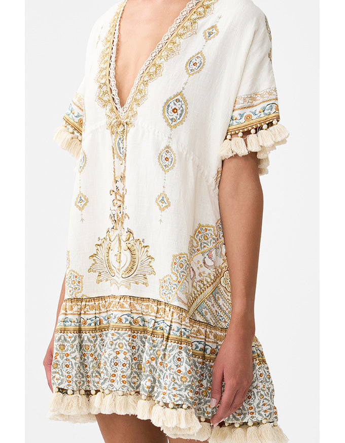 White dress with intricate patterns and embroidery on a white background.Ottoman Dynasty Short V Neck Embroidered Dress