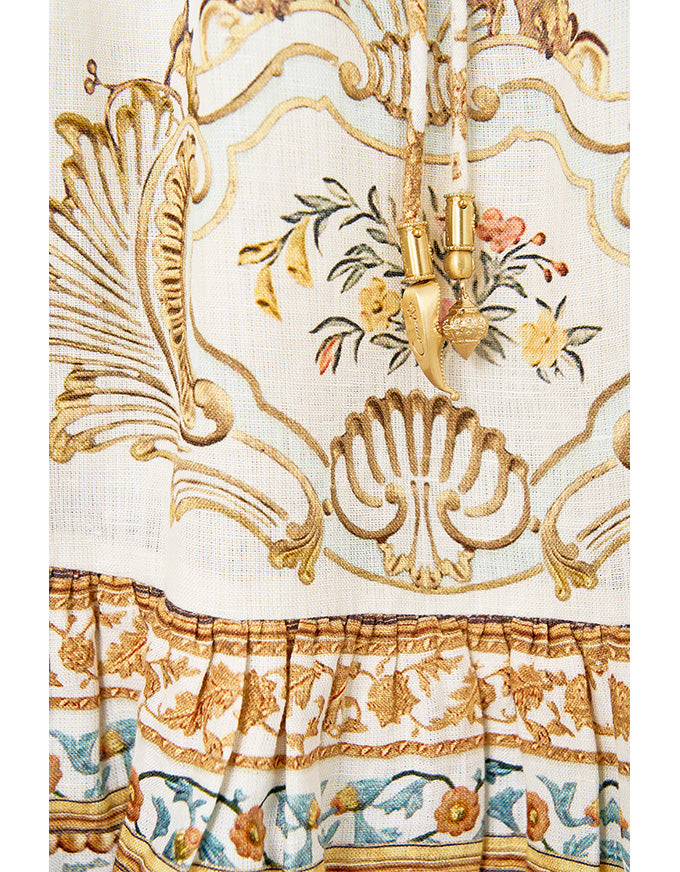 Close-up of a decorative fabric with intricate patterns and gold accents. Ottoman Dynasty Short V Neck Embroidered Dress