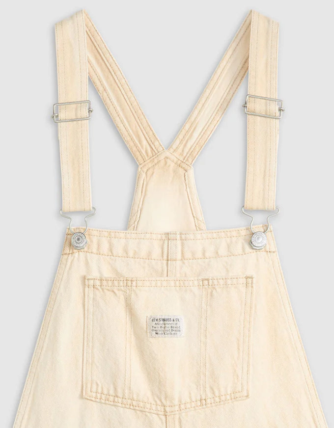 Beige overalls with suspenders on a light gray background. Vintage Overall Cloudy Travertine
