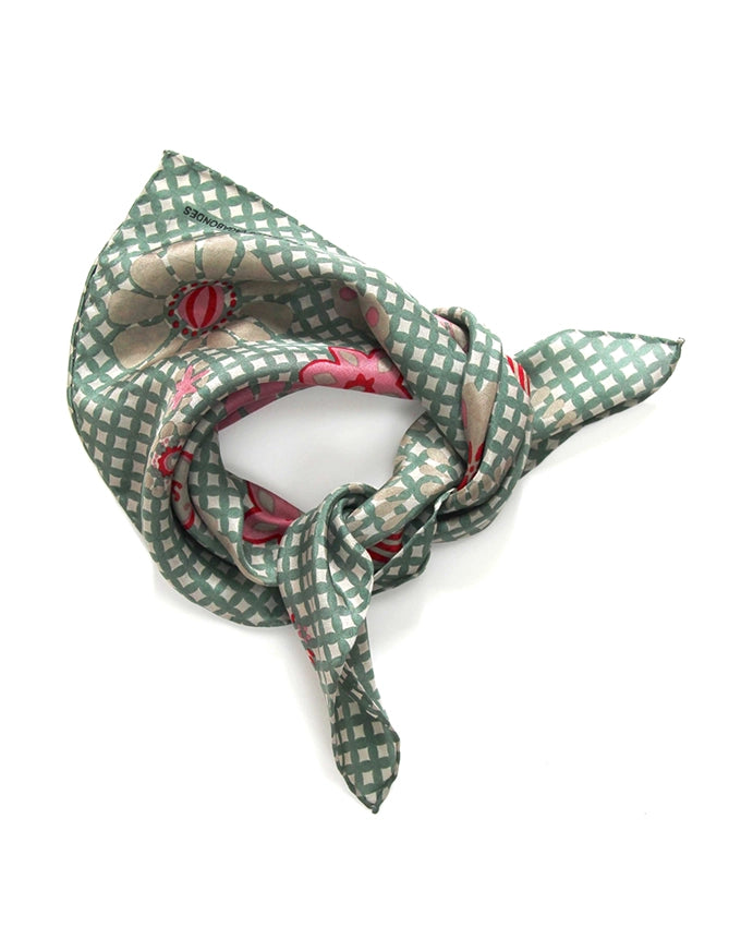 Green checkered scarf with floral patterns on a white background