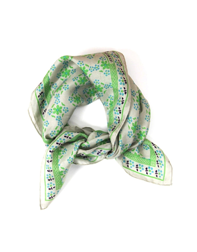 Green and white patterned scarf on a white background