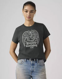Person wearing a black t-shirt with a graphic design and text on a plain background