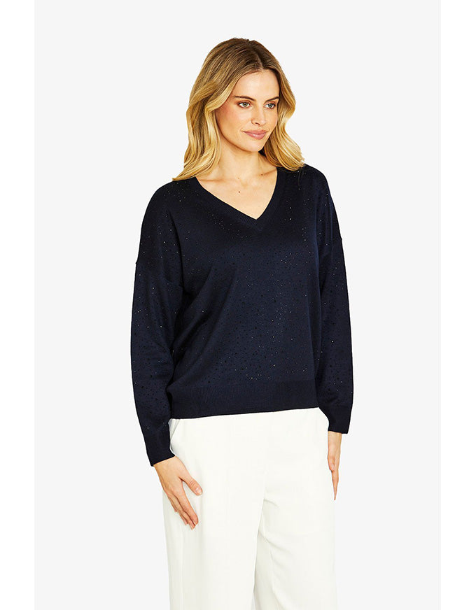 Woman wearing a black sweater on a white background
