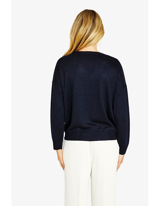 Person wearing a black sweater on a white background