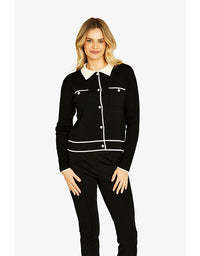 Woman wearing a black outfit with white accents on a white background