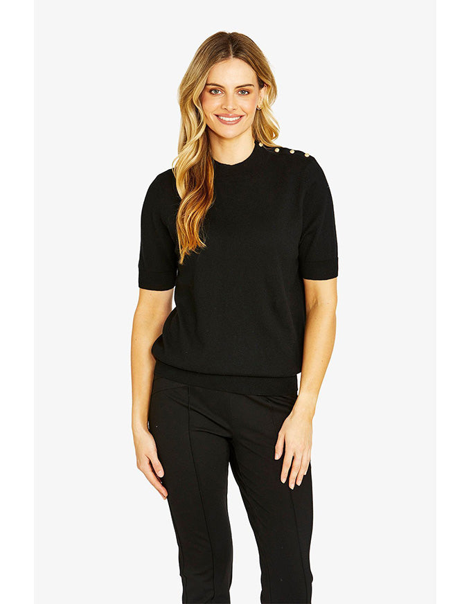 Woman wearing a black outfit on a white background