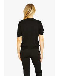 Person wearing a black outfit on a white background