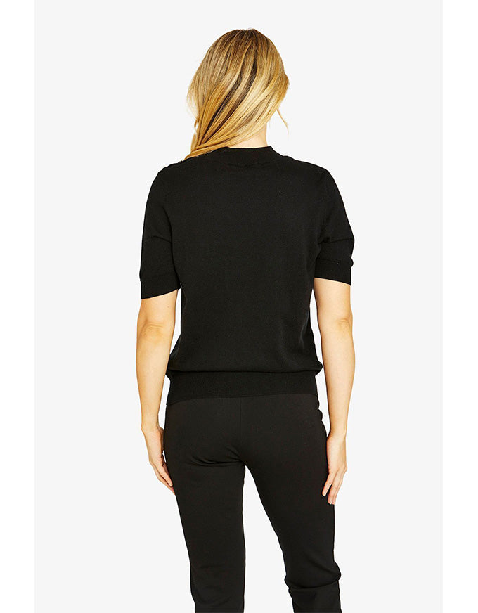 Person wearing a black outfit on a white background
