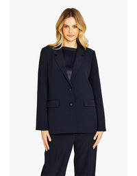 Woman wearing a navy suit on a white background