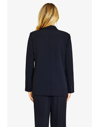 Person wearing a navy suit on a white background
