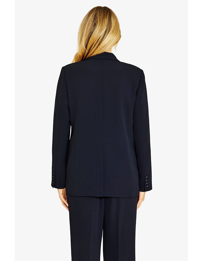 Person wearing a navy suit on a white background
