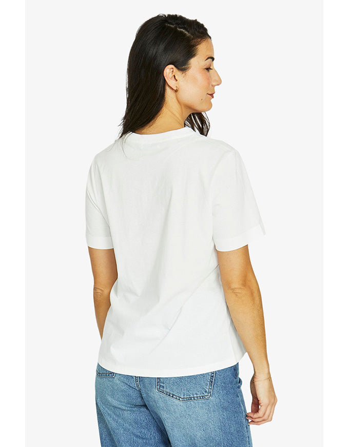 French short sleeve tee in ivory with ‘Amour Paris 1998’ chestnut print and crew neckline, worn on model