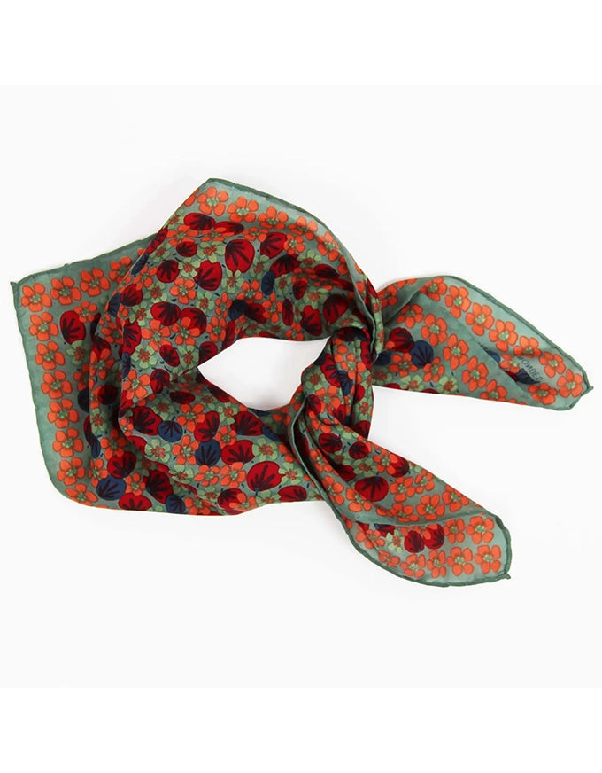 Patterned scarf with red and orange design on a white background