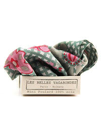 Folded patterned scarf with 'Les Belles Vagabondes' label on a white background