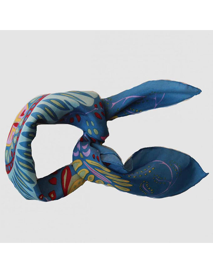 Colorful scarf with abstract patterns on a light gray background