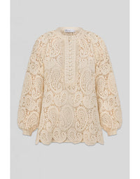 Beige lace blouse on a light gray background