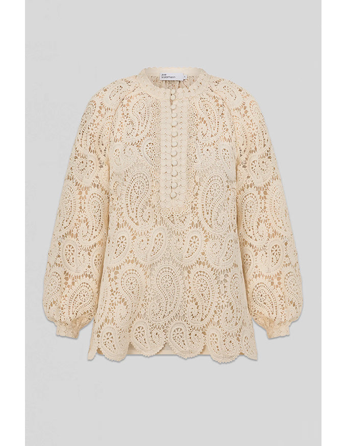 Beige lace blouse on a light gray background