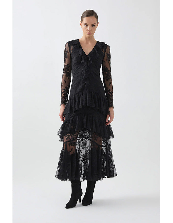 Black lace dress worn by a model on a white background