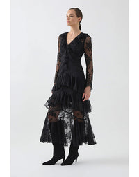 Woman wearing a black lace dress on a white background