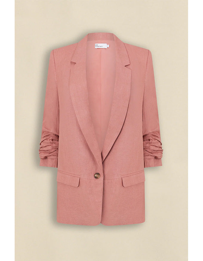 Pink blazer on a beige background