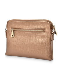 Rose gold crossbody bag with gold zipper on a white background