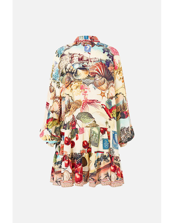 Colorful dress with a pattern on a white background. Notes From The Road L/S Tiered Short Dress
