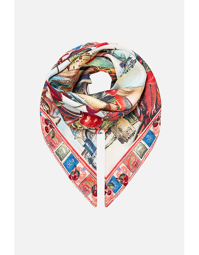 Colorful scarf with vintage-style design on a white background