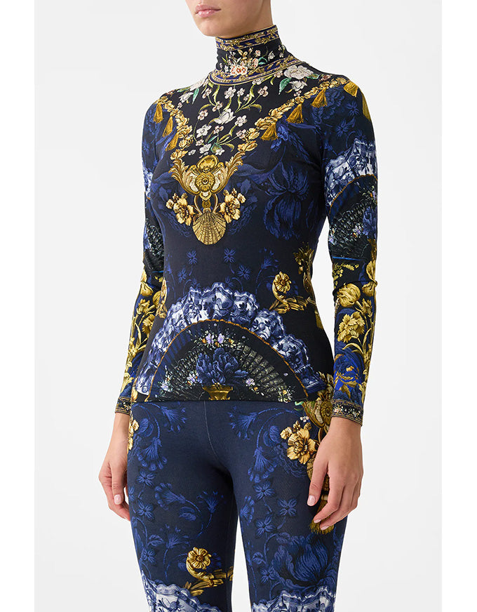 Navy blue outfit with gold and white floral patterns on a white background