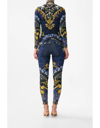 Navy blue outfit with gold and white floral patterns on a white background