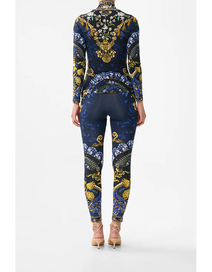Navy blue outfit with gold and white floral patterns on a white background