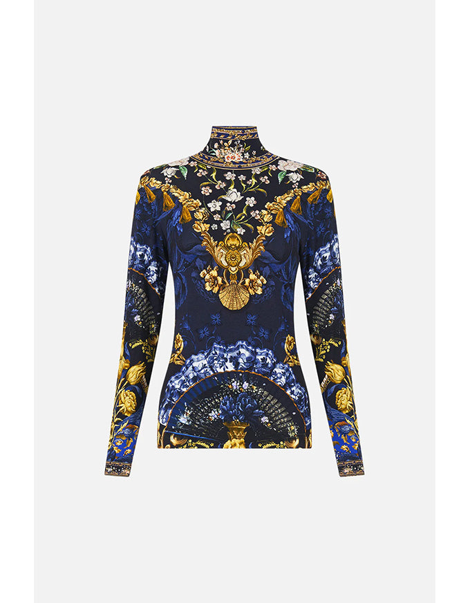 Decorative long-sleeve top with intricate patterns on a white background