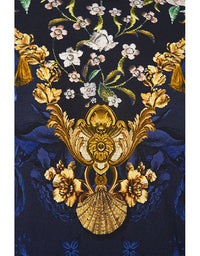 Decorative fabric with floral and shell pattern on a dark blue background