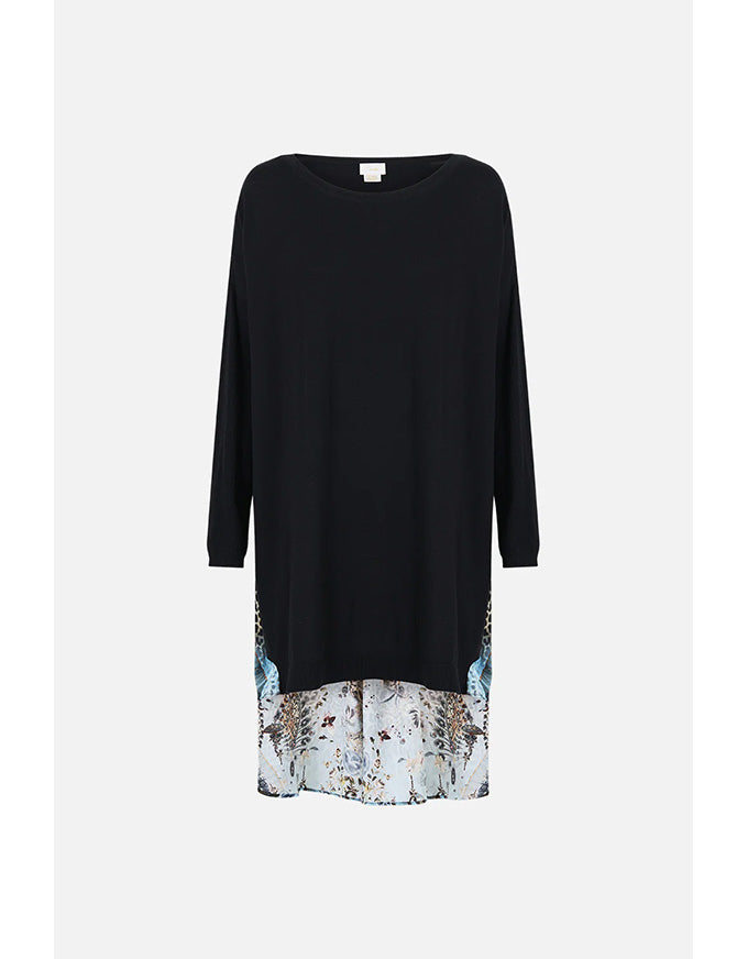 Black dress with floral hem on a white background