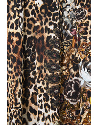 Close-up of fabric with leopard print and floral patterns.