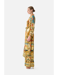 Woman wearing a colorful floral dress on a white background