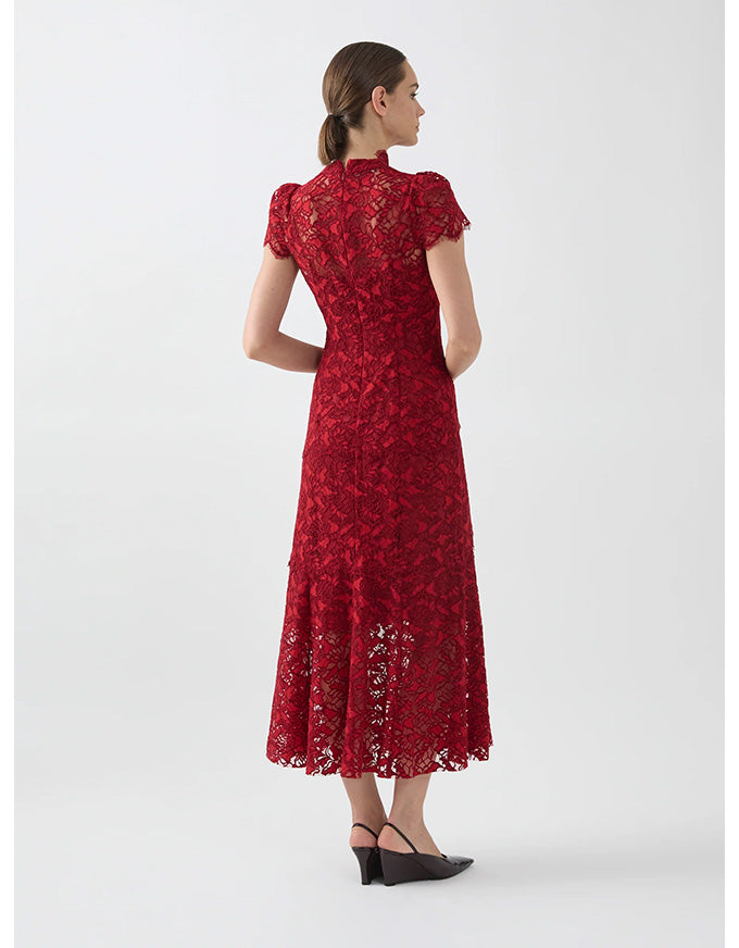 Woman wearing a red lace dress on a white background