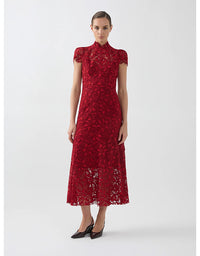 Red lace dress worn by a model on a white background