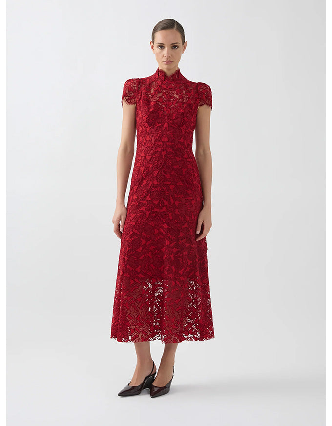Red lace dress worn by a model on a white background