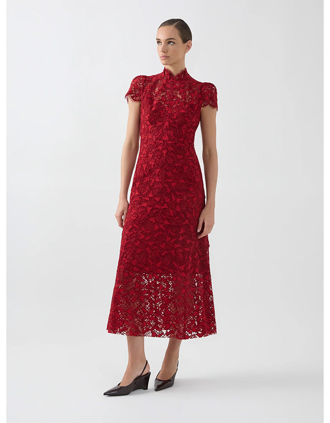 Woman wearing a red lace dress on a white background