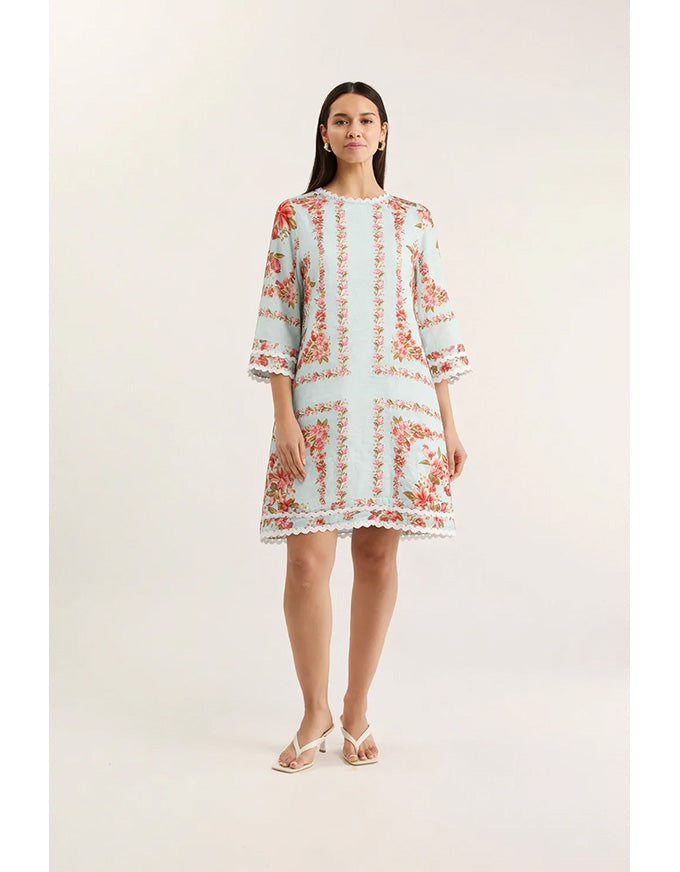 Woman wearing a floral dress on a white background