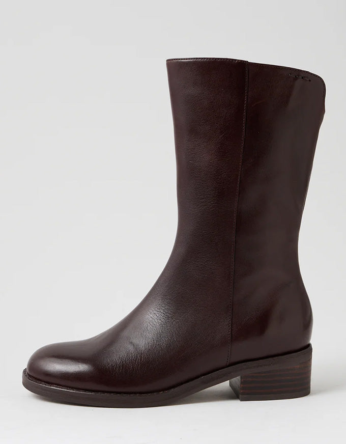 Brown leather boot with decorative stitching on a white background