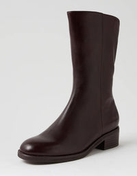 Brown leather boot on a light gray background