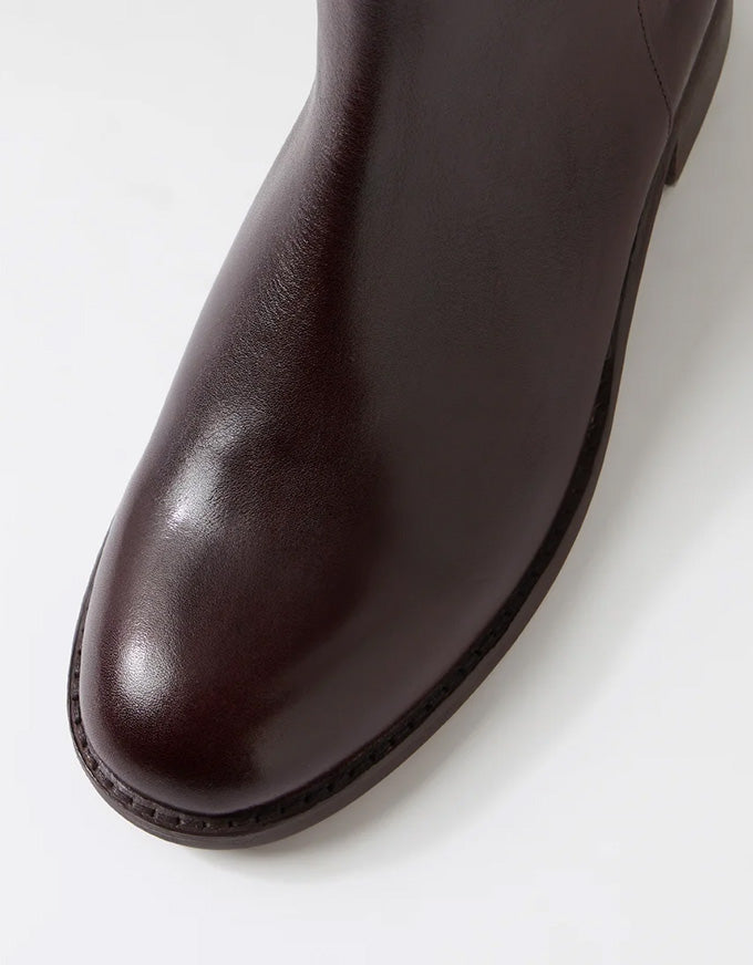 Brown leather ankle boot on a white background