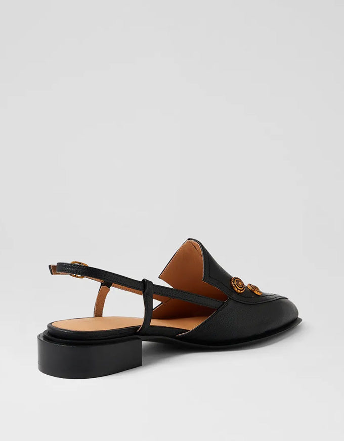 Black sandal with brown interior on a light gray background