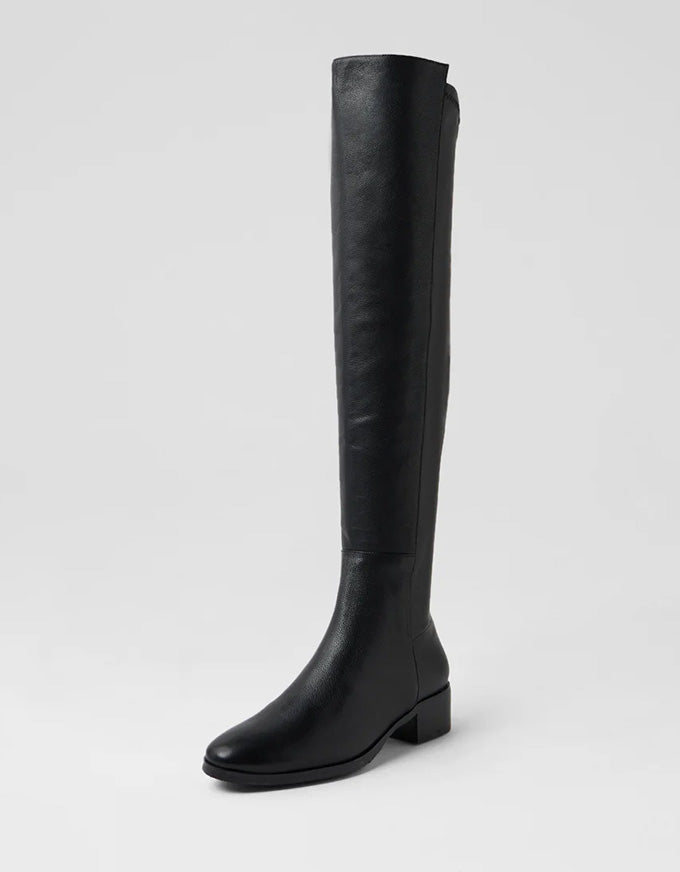 Black knee-high boot on a light gray background