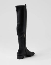 Black knee-high boot on a white background