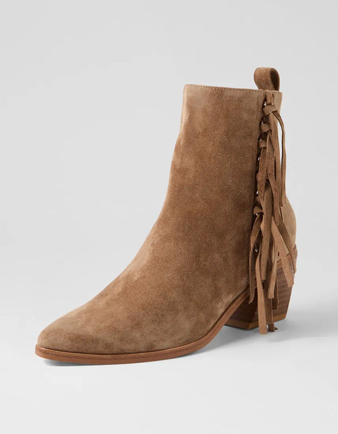 Brown suede ankle boot with fringes on a light gray background