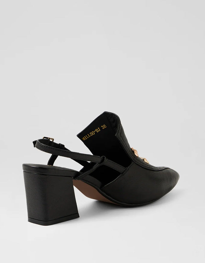 Black high-heeled shoes on a light gray background